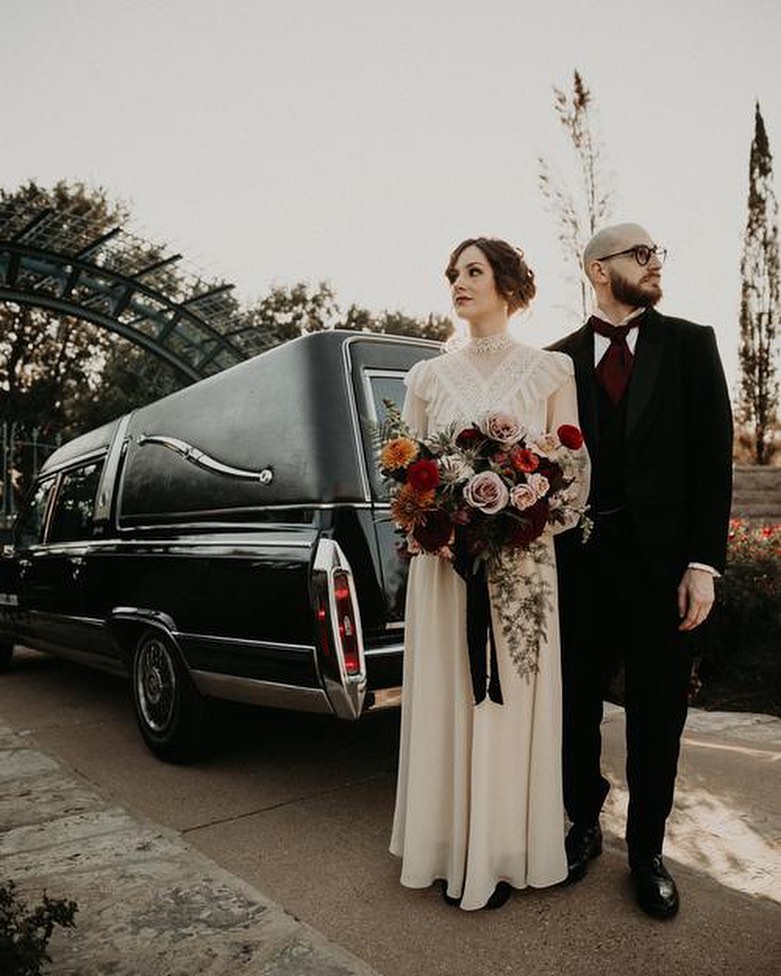 Wedding party in the black hearse